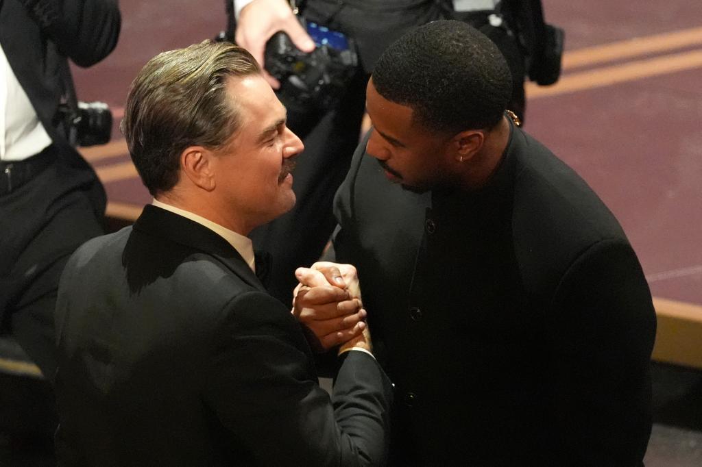 Leonardo DiCaprio, left, and Michael B. Jordan in the audience during the Oscars