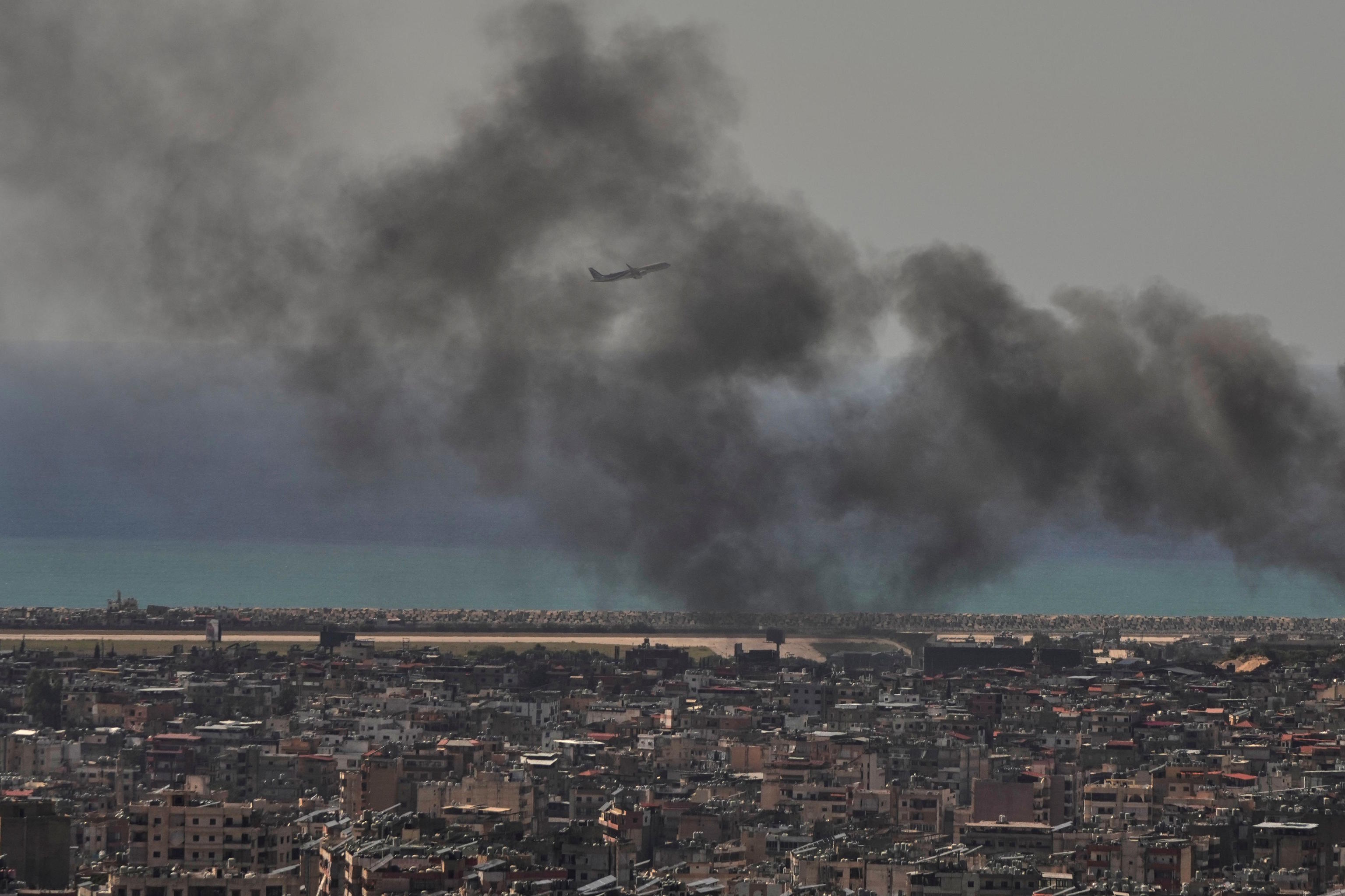 A column of smoke rises over Beirut, the capital of Lebanon.