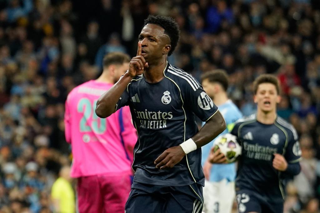 Real Madrid's scorer Vinicius Junior celebrates after scoring