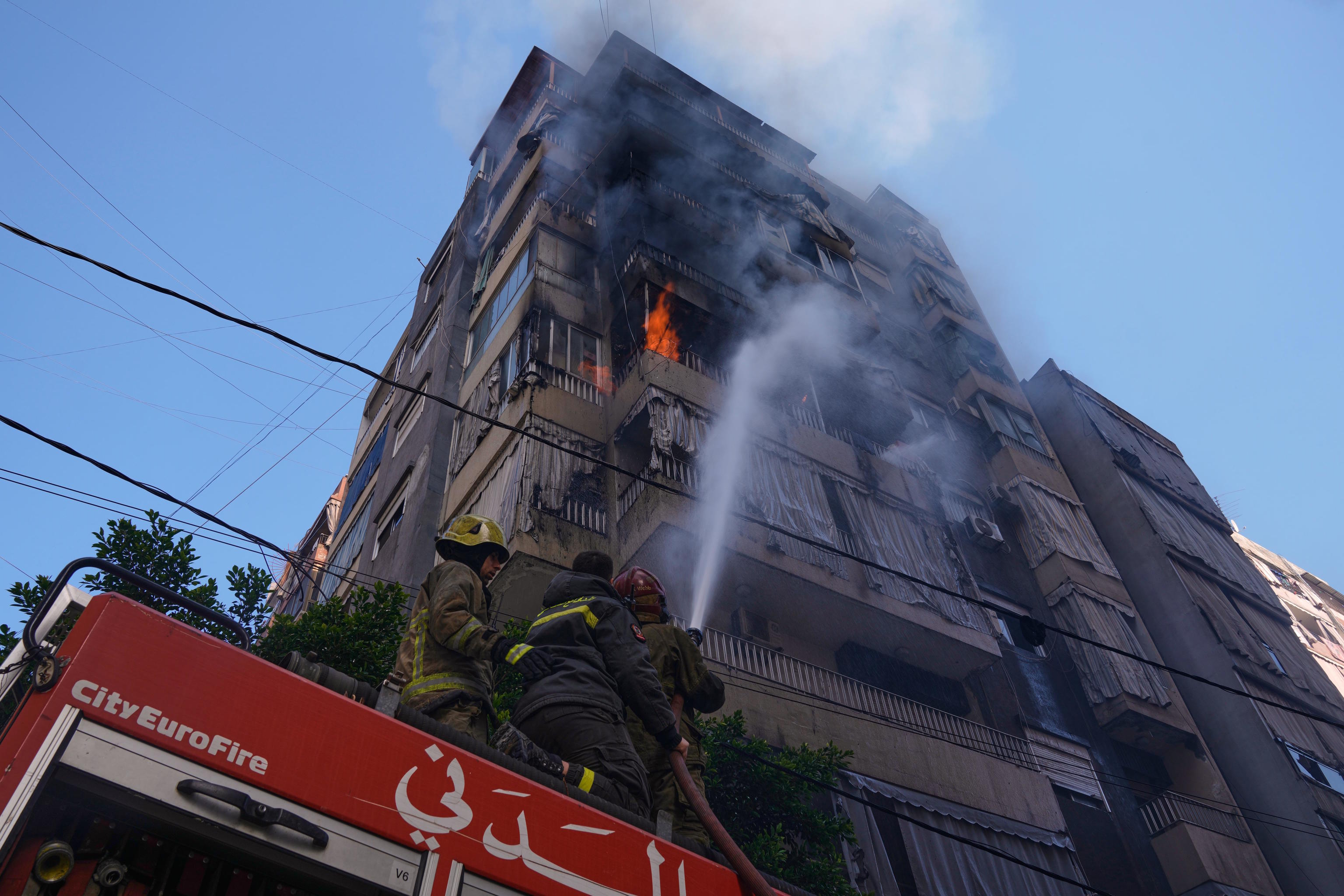 A burning residential building following an Israeli airstrike in central Beirut.