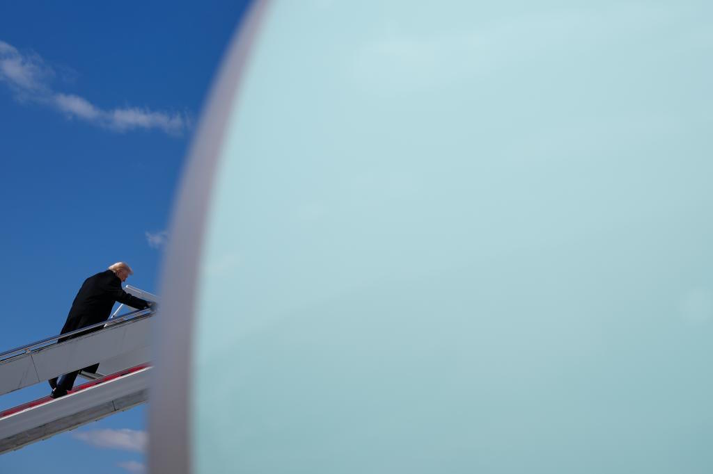 President Donald Trump boards Air Force One.
