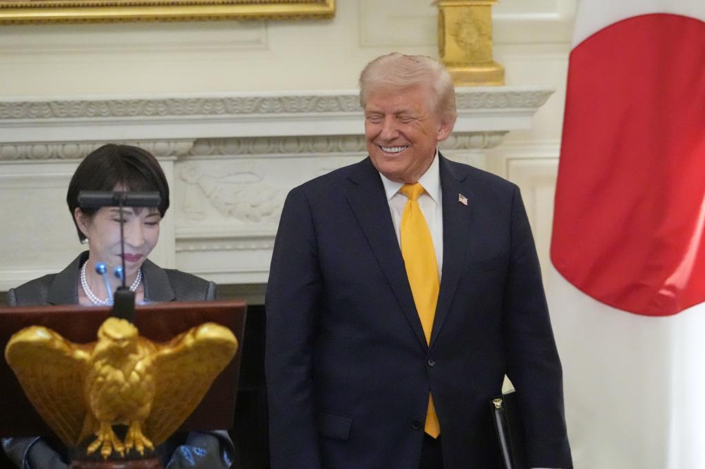 Japan's Prime Minister Sanae Takaichi speaks during a dinner with President Donald Trump