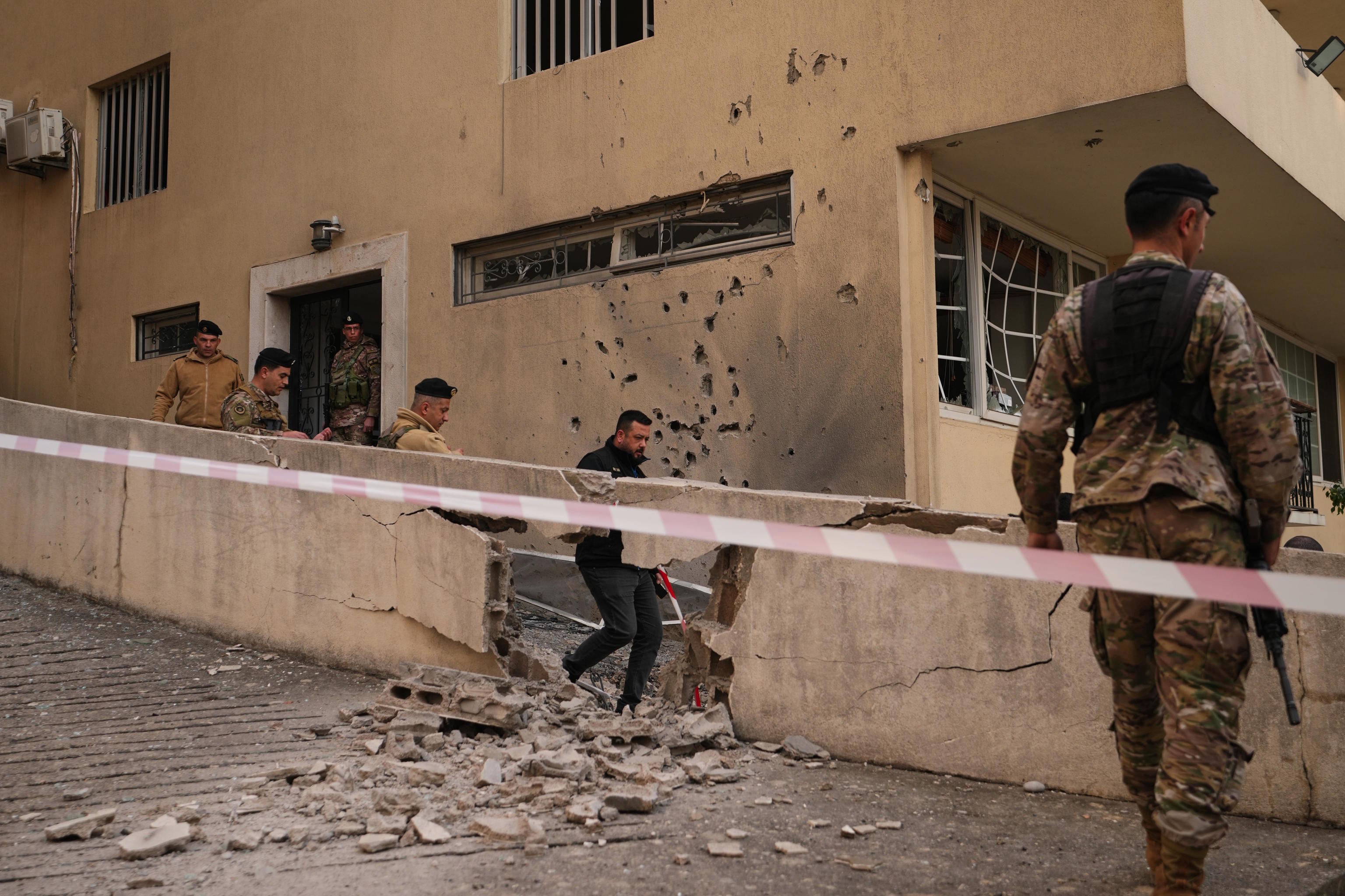 Army soldiers check the site where intercepted missiles fell in Sahel Alma, north of Beirut.