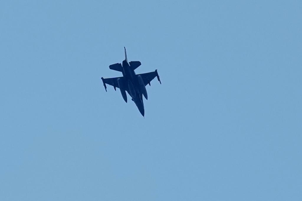 An Israeli warplane flies over the city of Tyre.