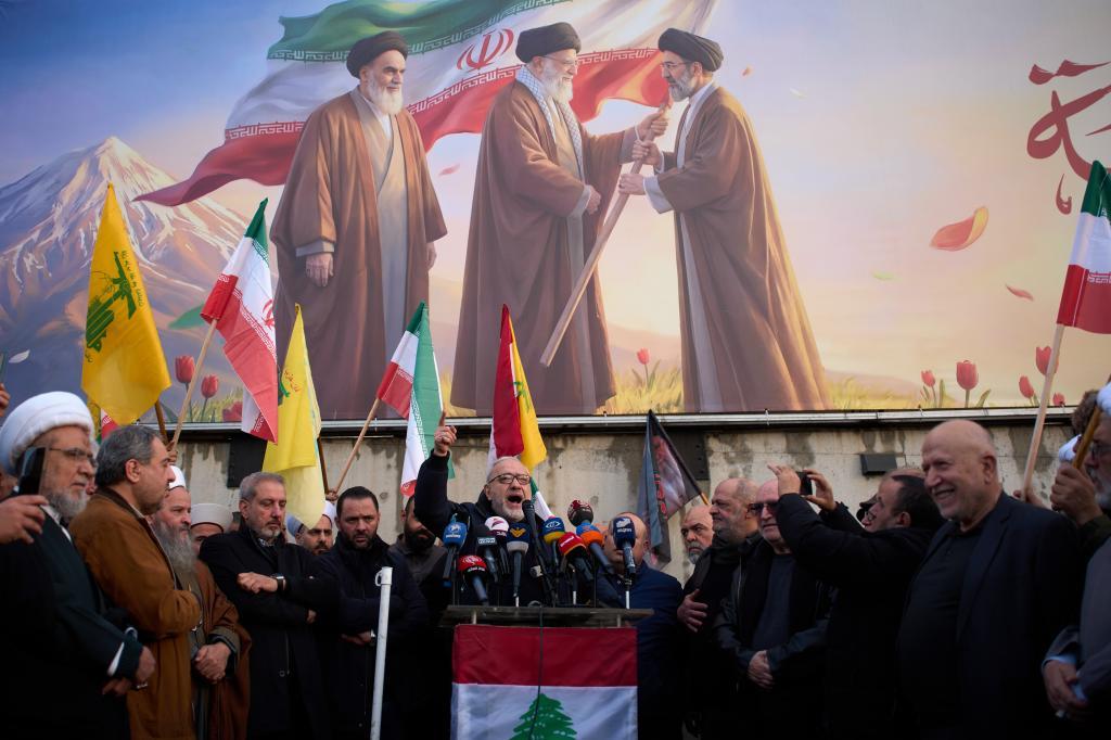 Senior Hezbollah official Mahmoud Qamati delivers a speech during a protest outside Iran's embassy