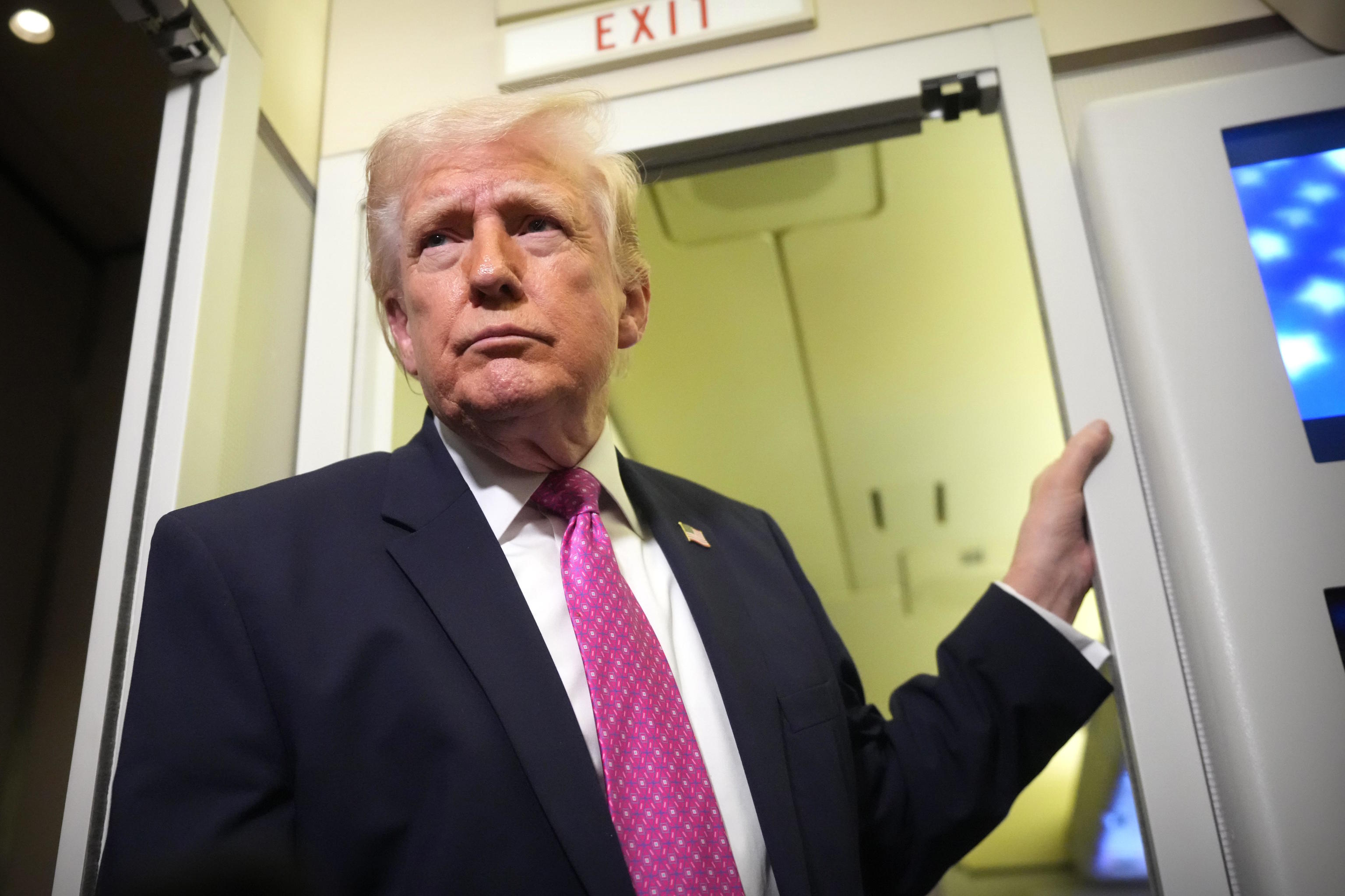 Donald Trump disembarks from Air Force One.