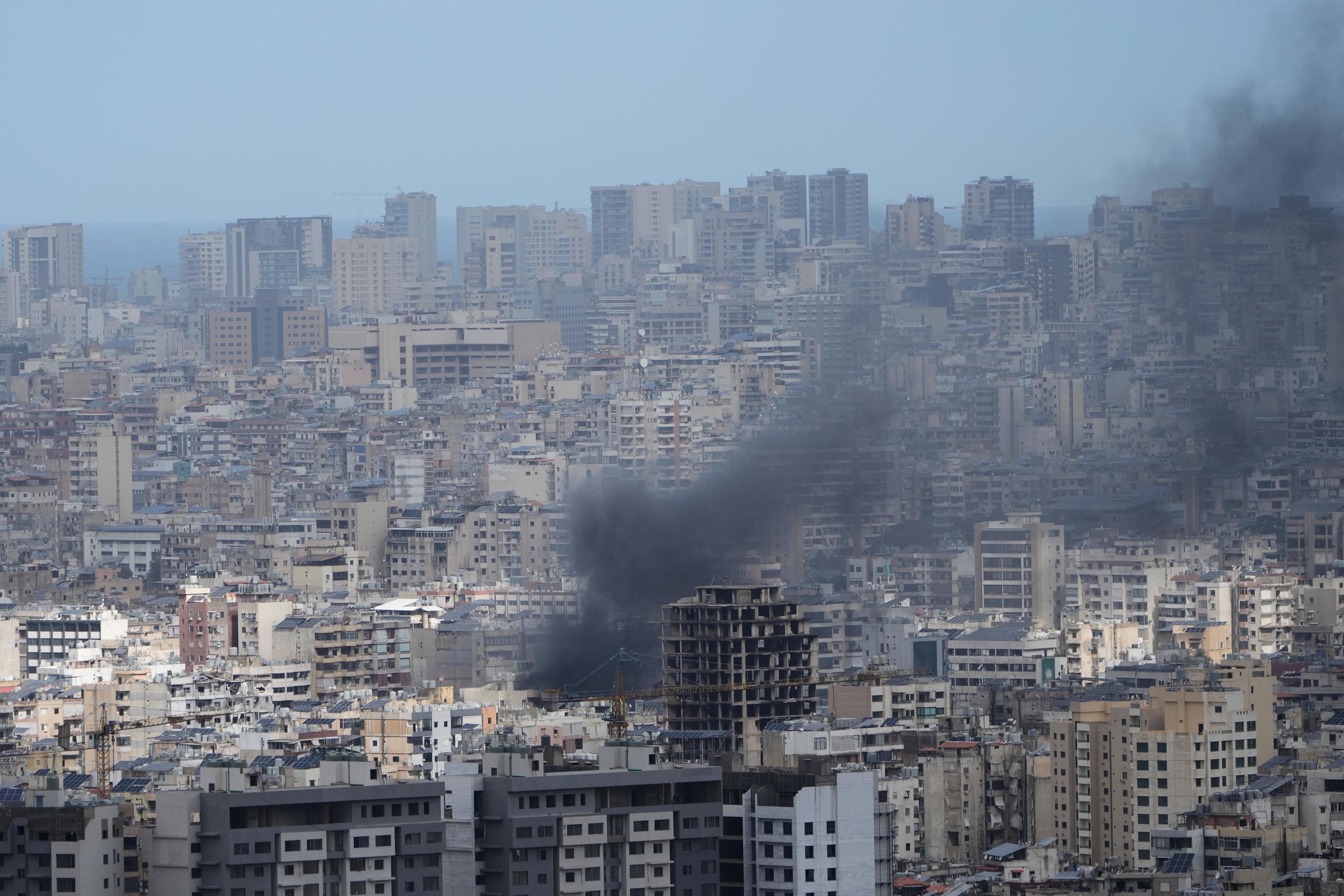 A column of smoke rises after an Israeli airstrike in Dahiyeh, in the southern suburbs of Beirut.