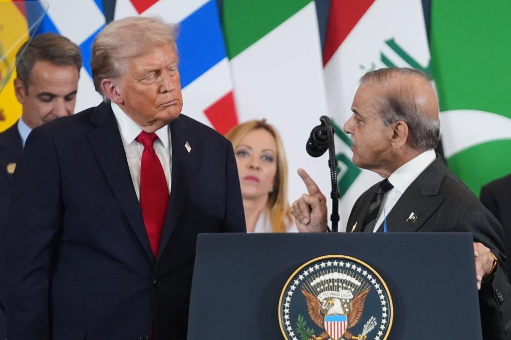 President Donald Trump, left, listens as Pakistan's Prime Minister Shehbaz Sharif