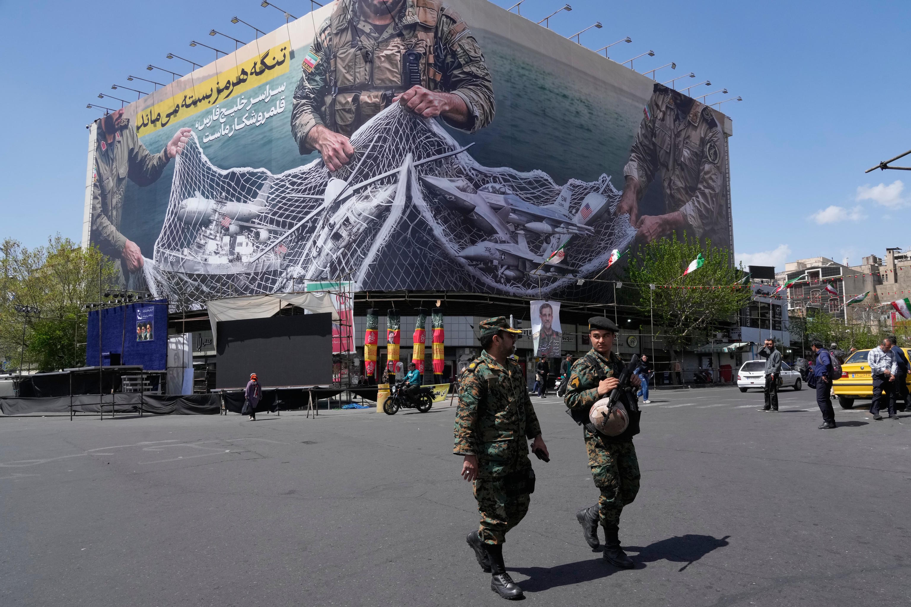 An anti-U.S. billboard depicting the American aircrafts into the Iranian armed forces fishing net.