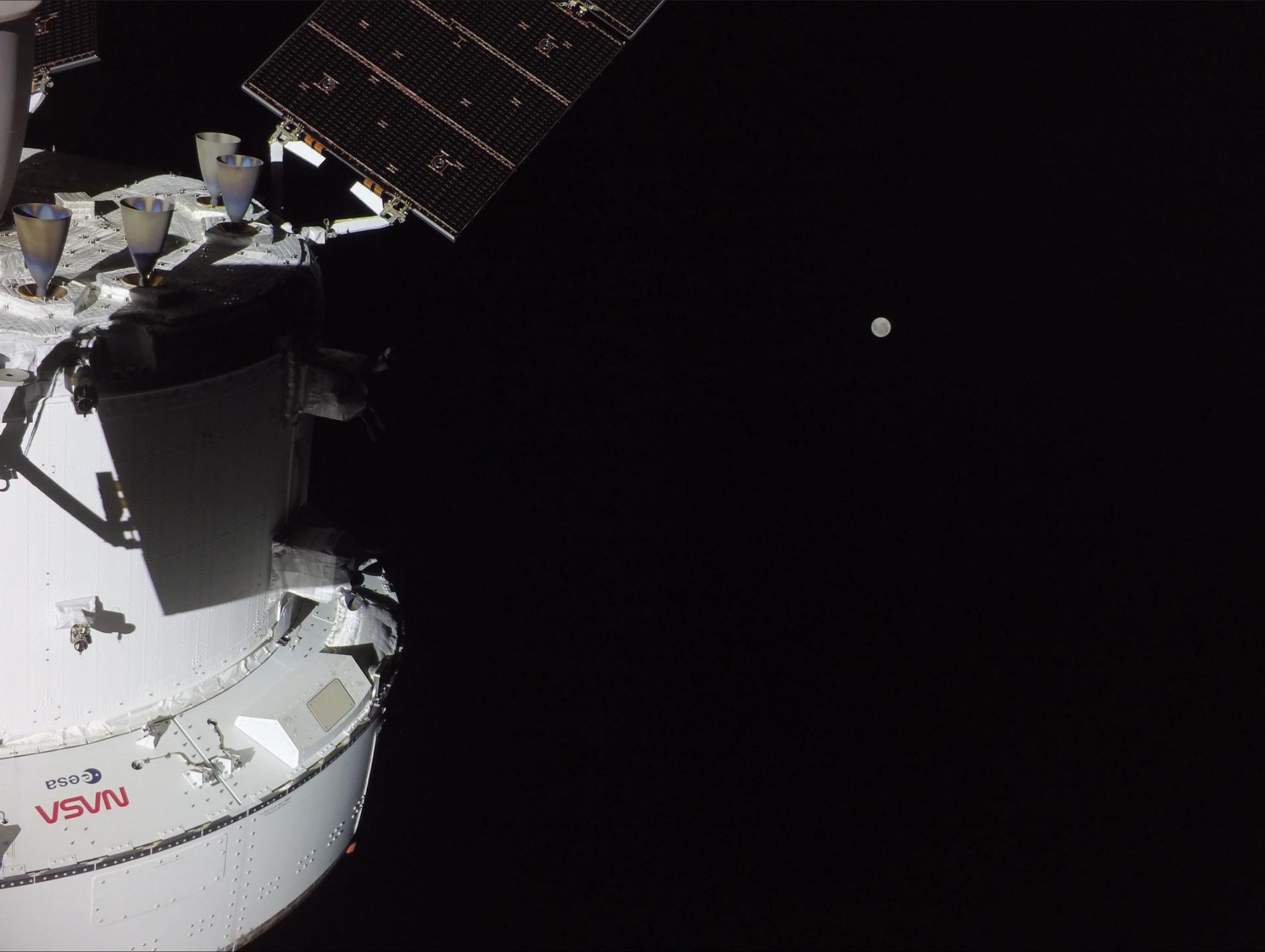 This image provided by NASA shows the Orion spacecraft with the Moon in the distance.