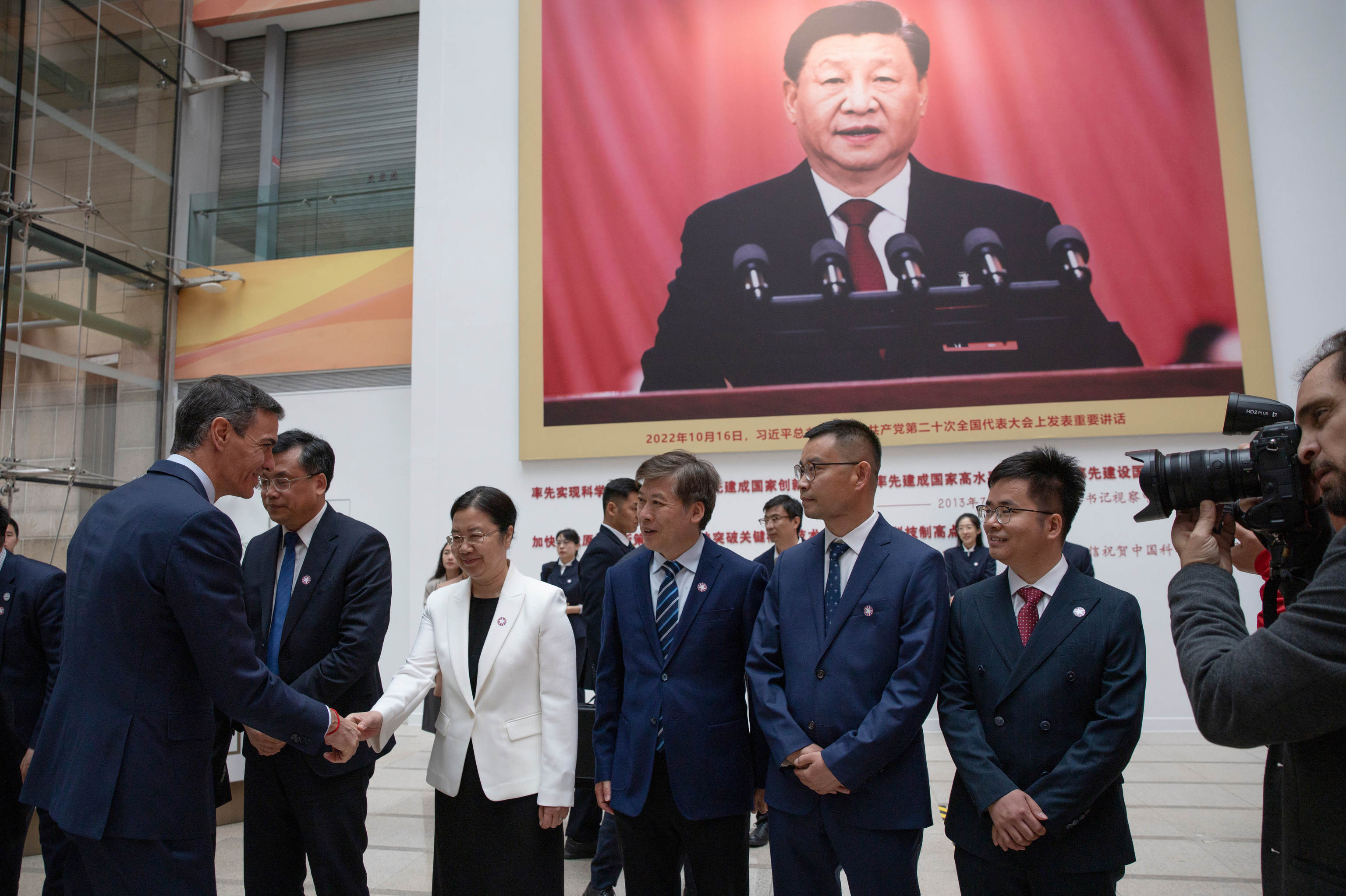 Spanish Prime Minister Pedro Sanchez, left, arrives at the University of Chinese Academy of Sciences in Beijing.