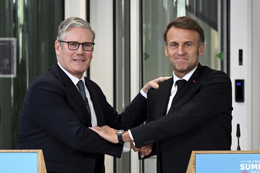 British Prime Minister Keir Starmer, left, greets French President Emmanuel Macron
