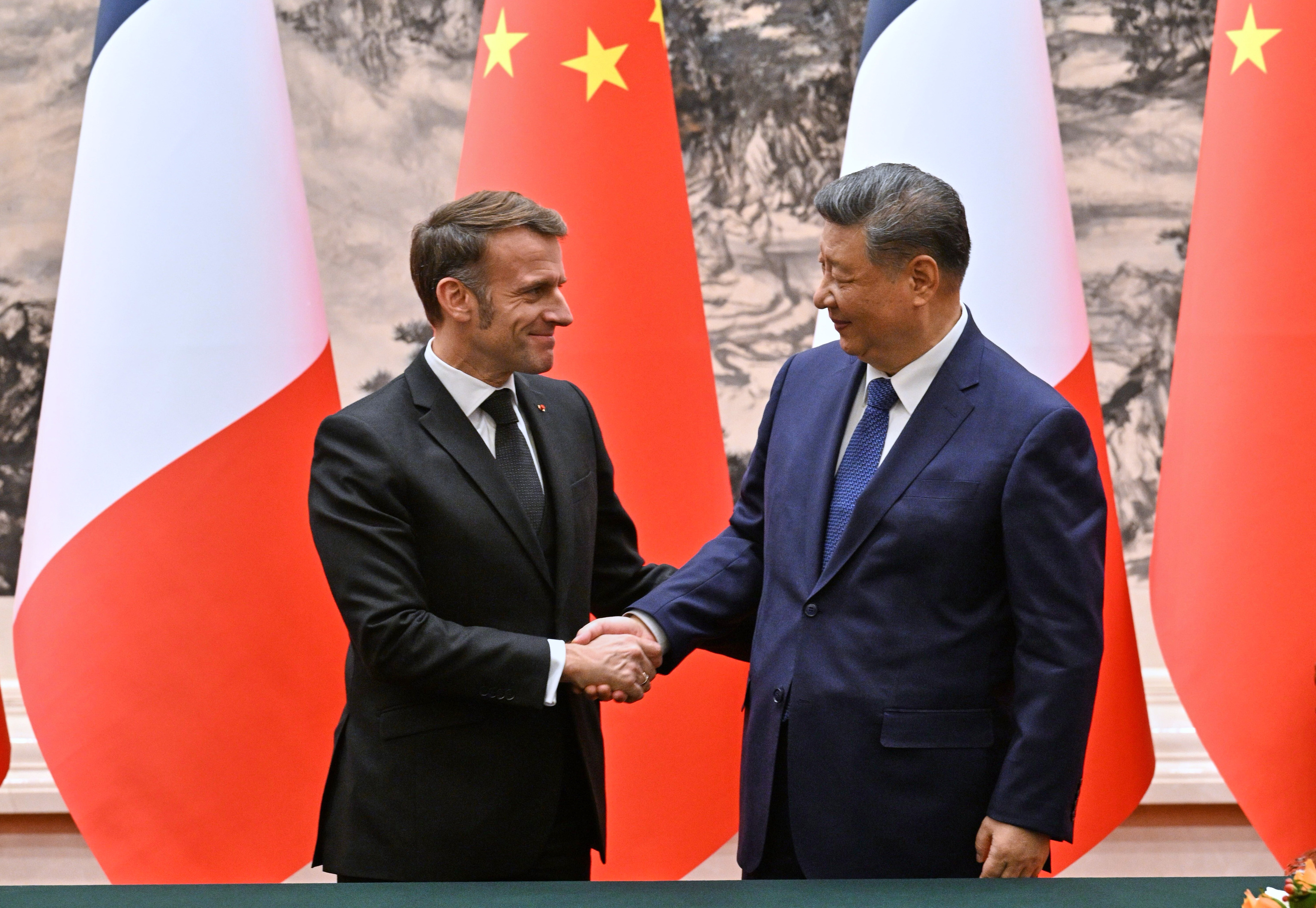 France's President Emmanuel Macron, left, and China's President Xi Jinping, right.
