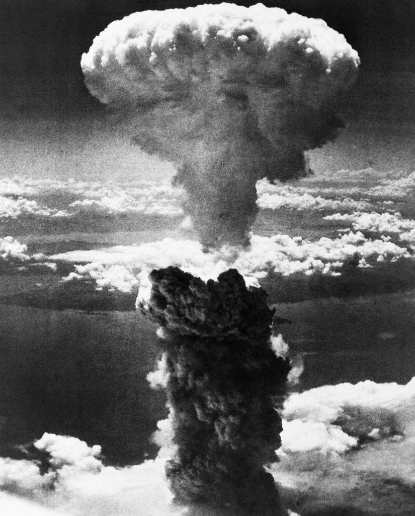 A giant column of smoke rises after the second atomic bomb ever used in warfare explodes over the Japanese port town of Nagasaki.