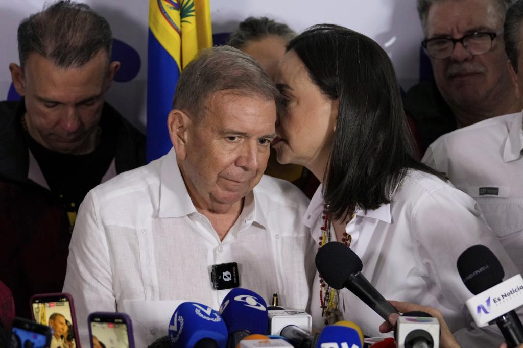 Opposition leader Maria Corina Machado talks to presidential candidate Edmundo Gonzalez