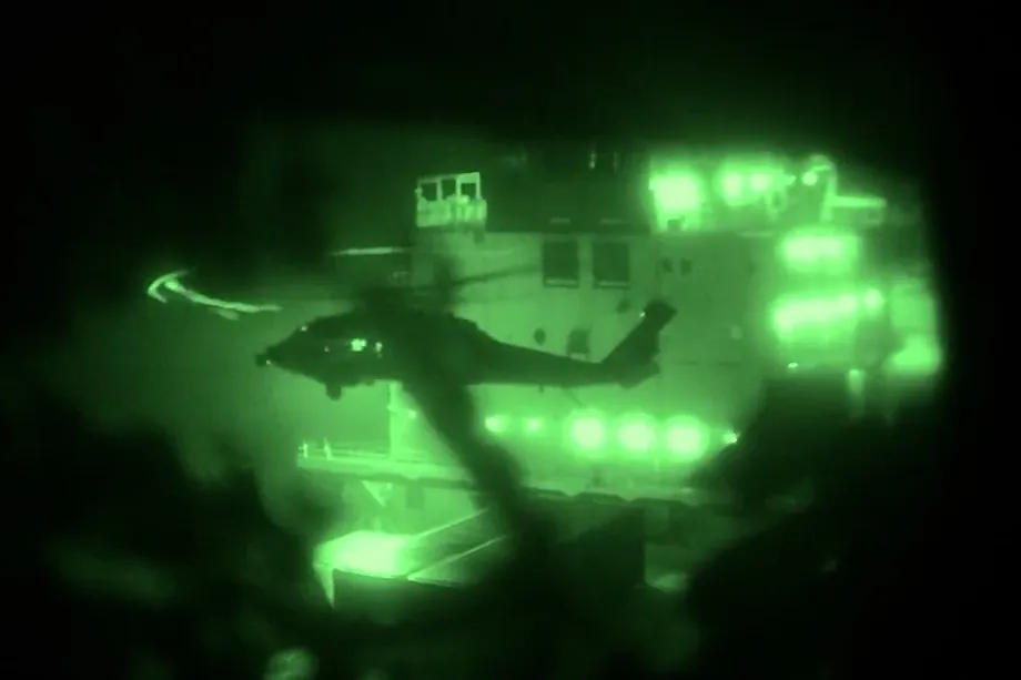 US Marines depart by helicopter to board and capture the Iranian ship.