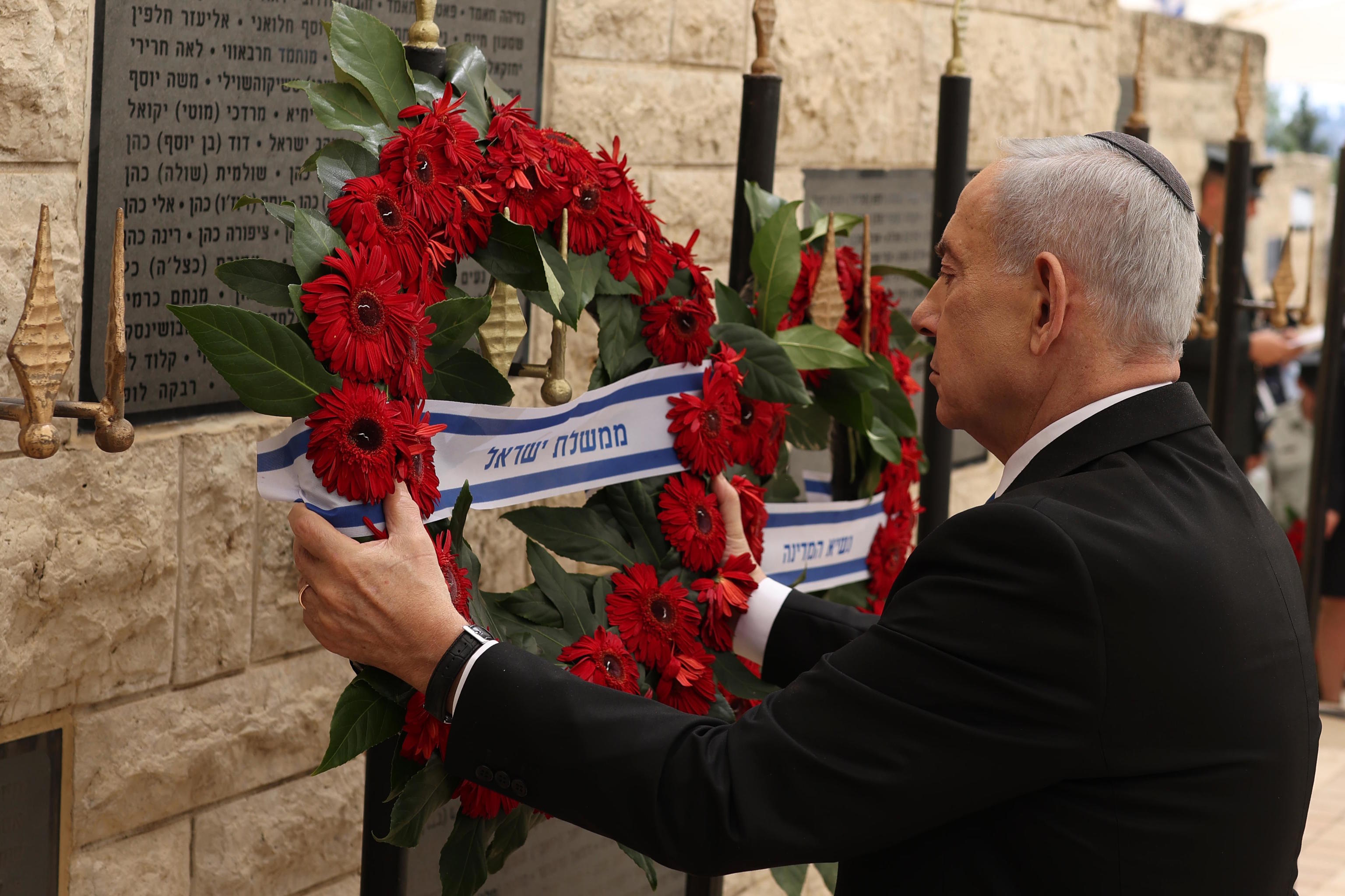 Israel's Prime Minister Benjamin Netanyahu places a wreath during a ceremony commemorating.