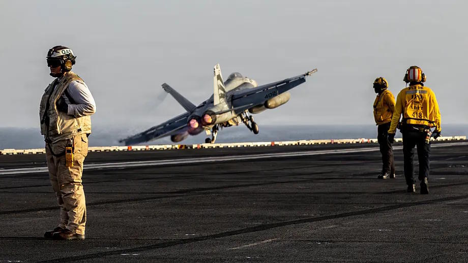 An F/A-18E Super Hornet takes off from the aircraft carrier Abraham Lincoln.