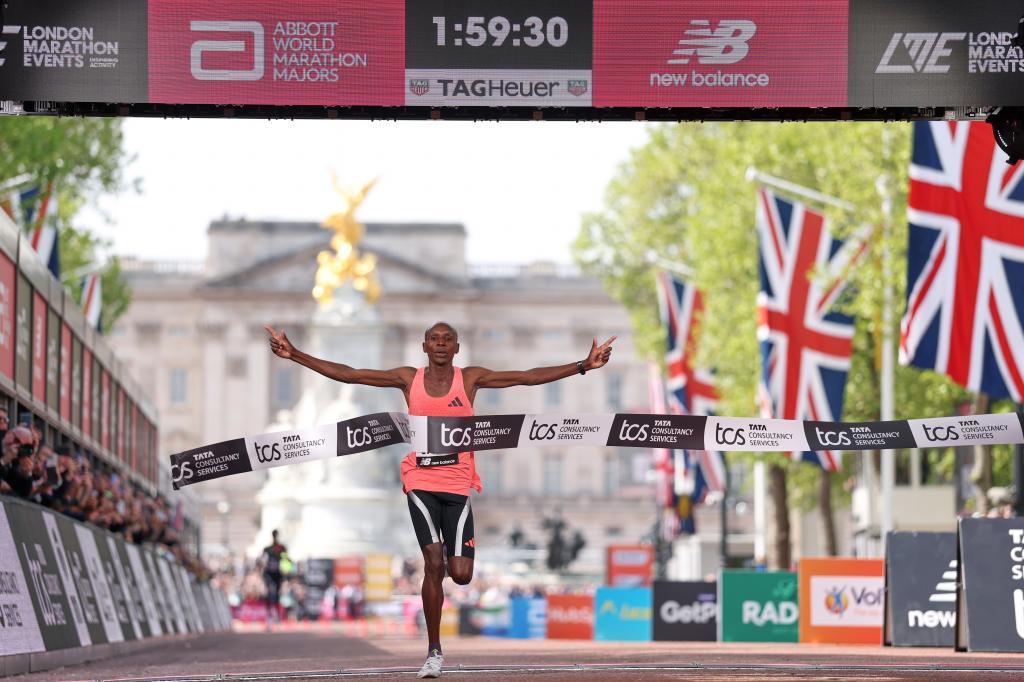Sebastian Sawe from Kenya crosses the finish line to win the men's race at the London Marathon