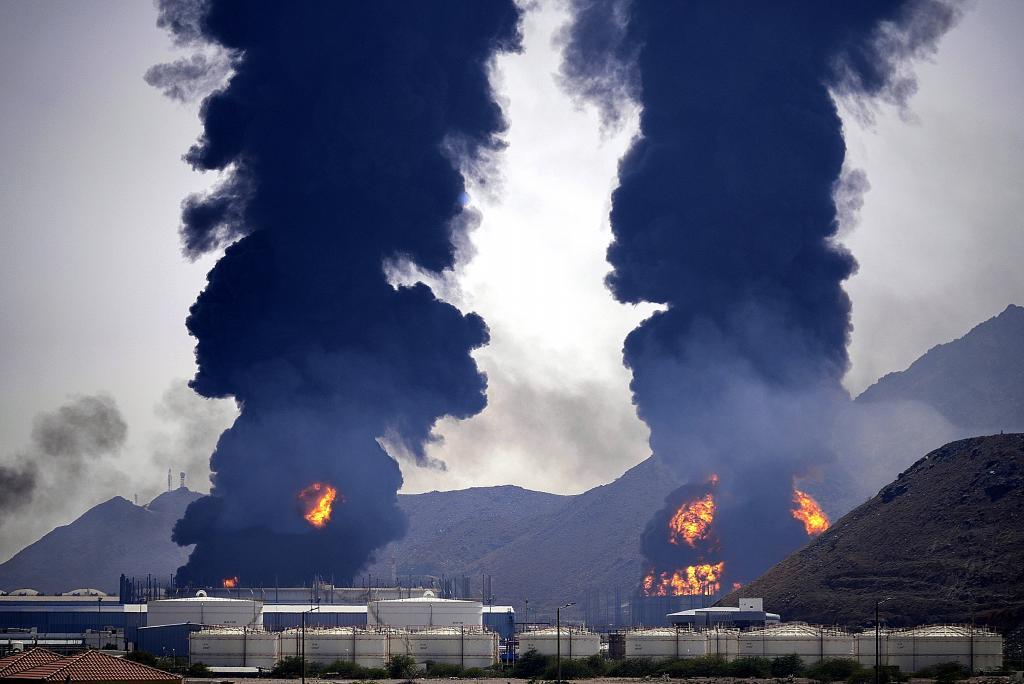Plumes of smoke and fire rise after debris from an intercepted Iranian drone struck an oil facility, according to authorities, in Fujairah