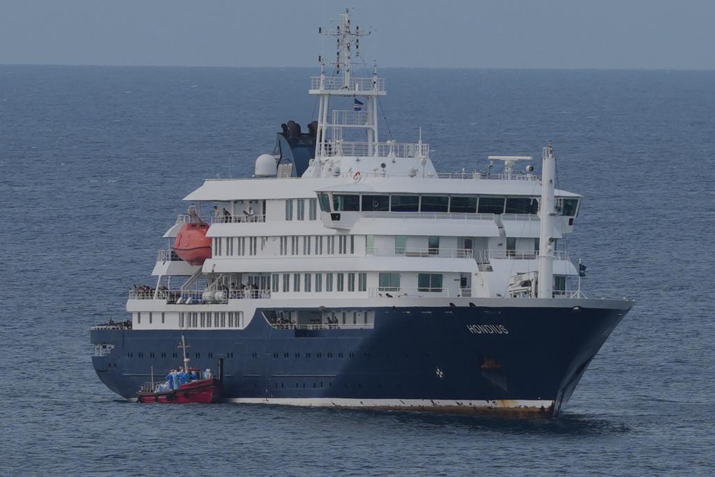 The MV Hondius cruise ship is anchored at a port in Praia, Cape Verde,
