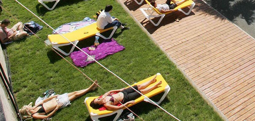 Sunbeds with towels.