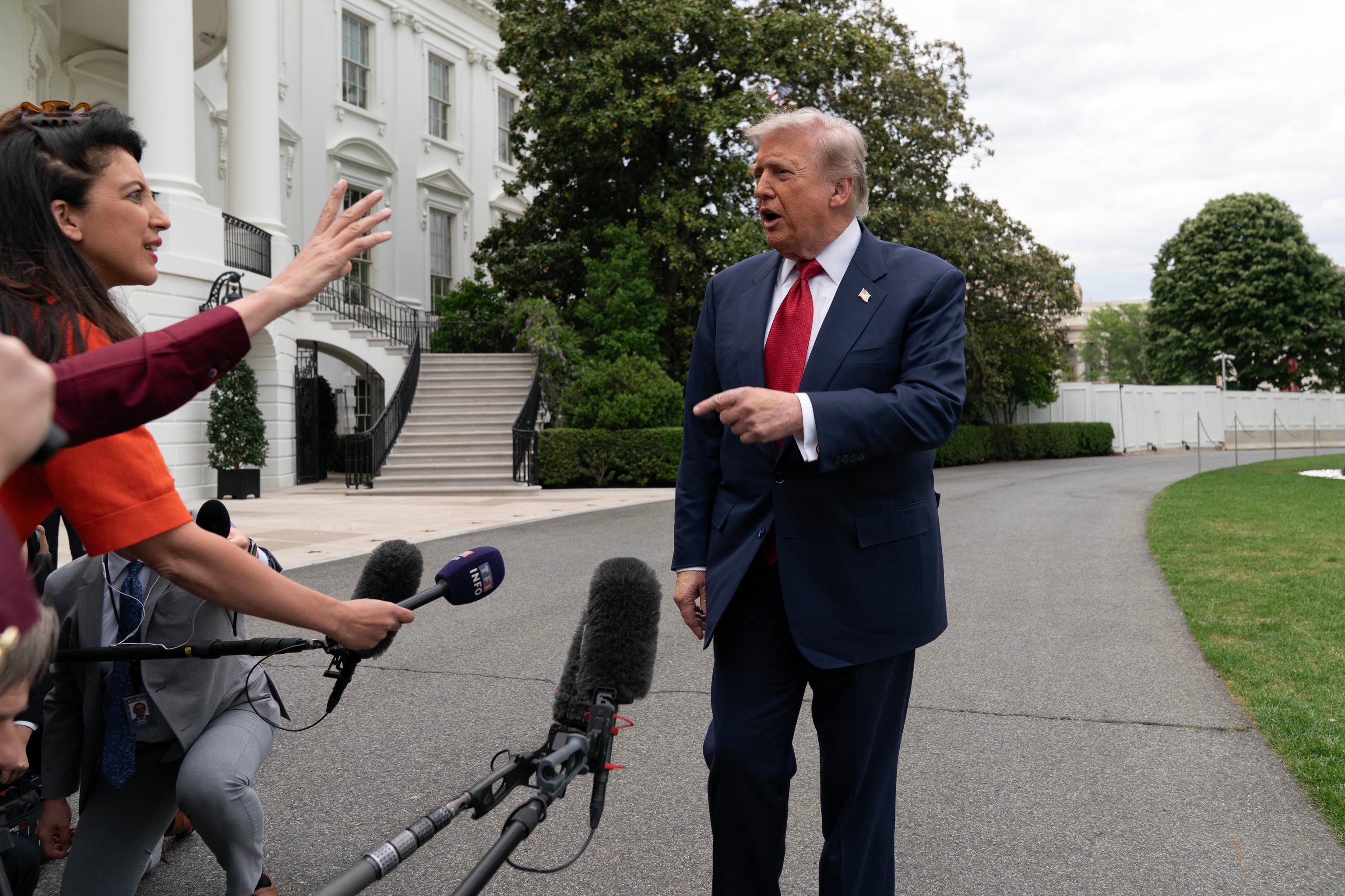 President Donald Trump speaks to reporter.
