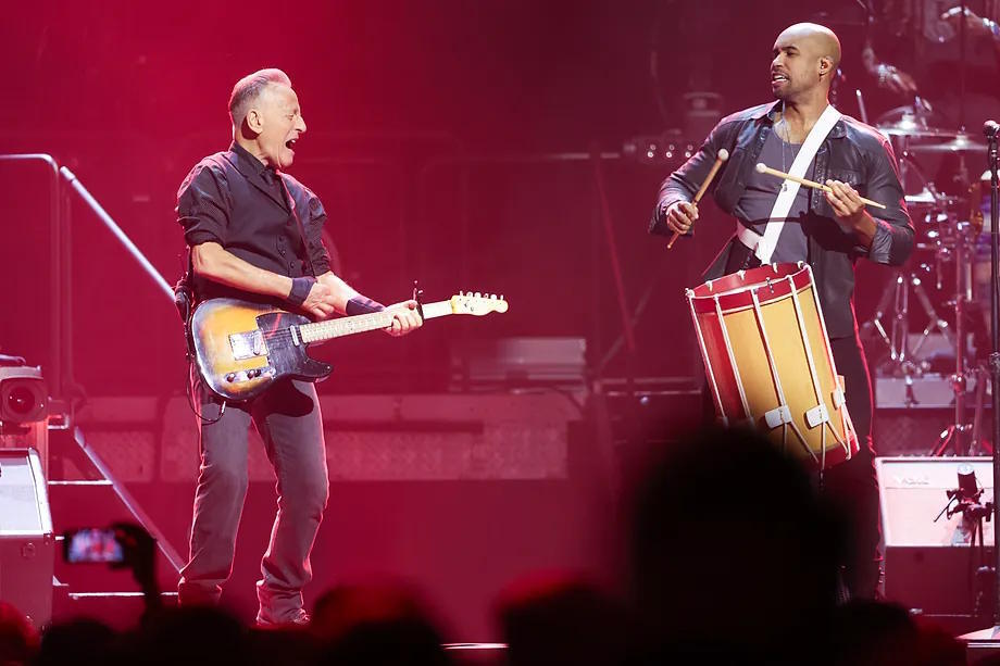 Anthony Almonte, alongside Springsteen at a concert.