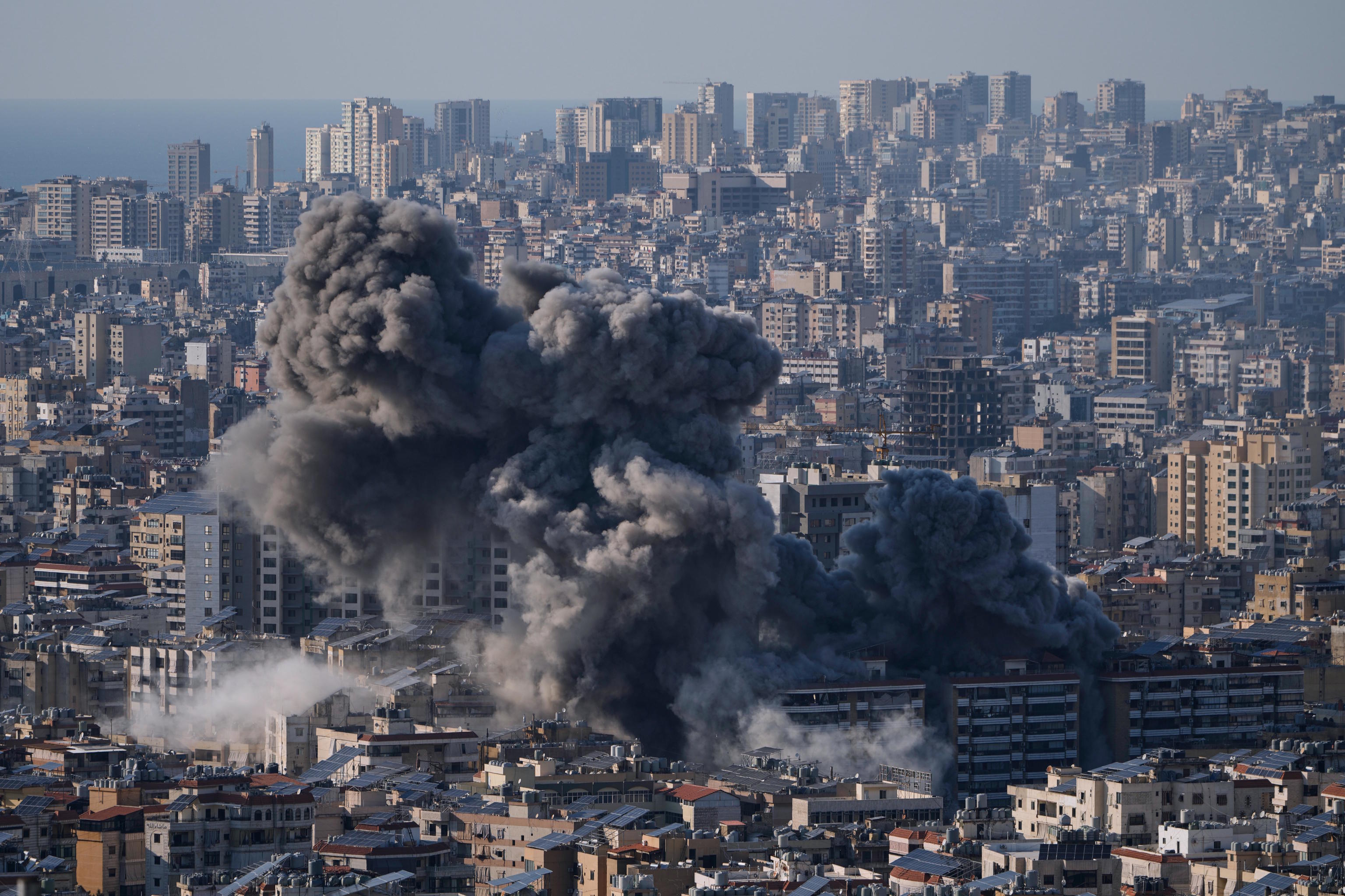 Smoke rise from an Israeli airstrike in Dahiyeh, Beirut's.