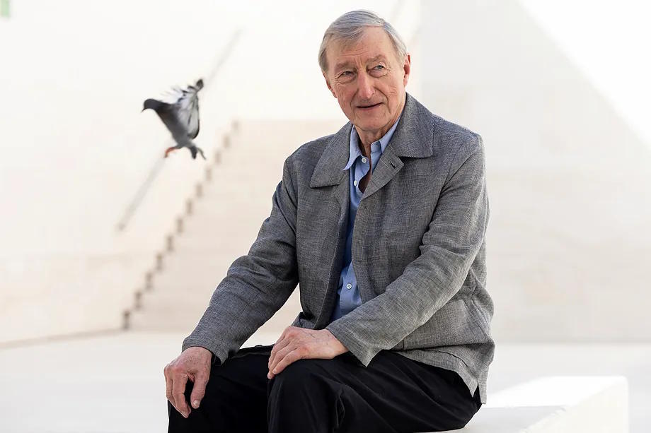 Julian Barnes in the CaixaForum lobby, with a flying dove included.