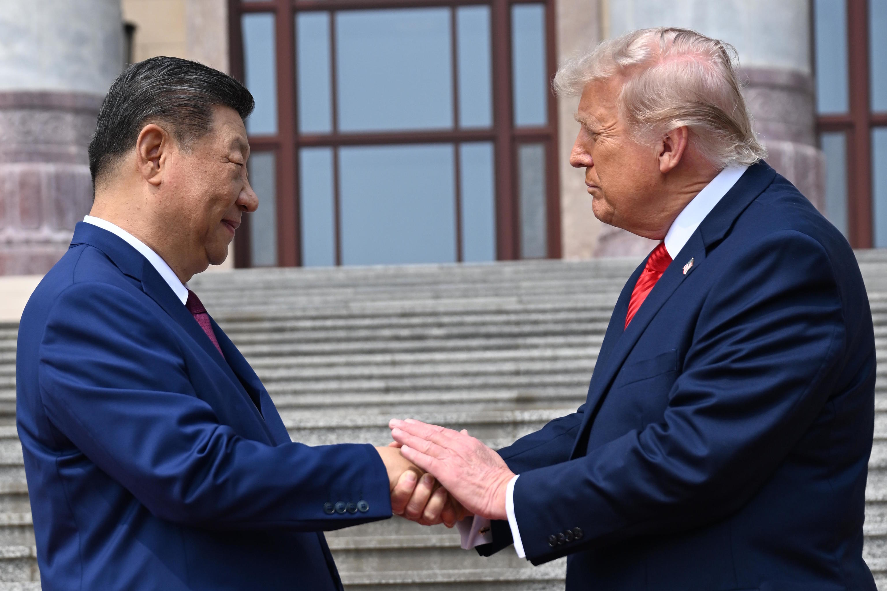 Chinese President Xi Jinping shakes hands with U.S. President Trump.