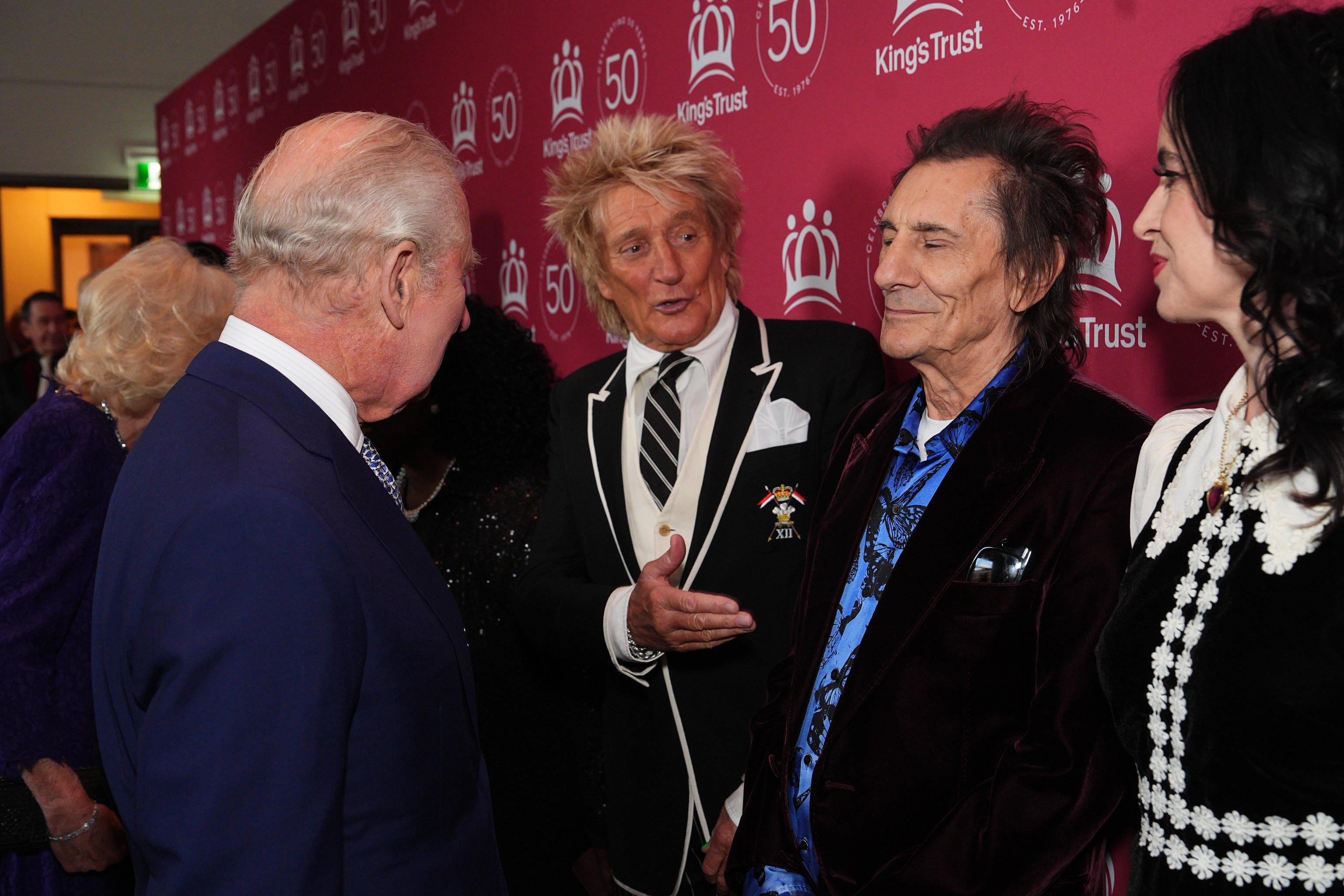Britain's King Charles III meets Rod Stewart, Ronnie and Sally Wood.