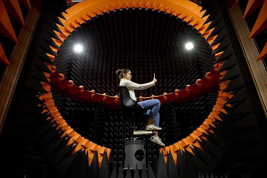 An Apple employee tests one of the phones in an anechoic chamber.