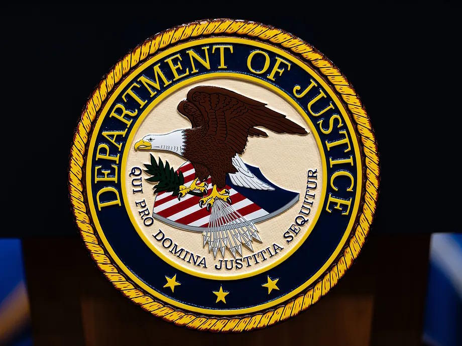 The logo of the US Department of Justice on a podium.