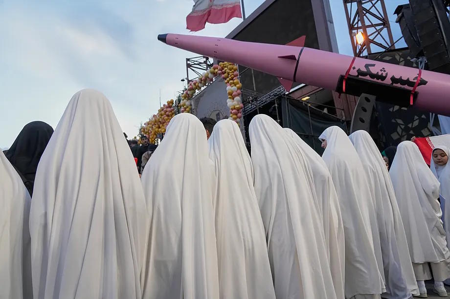 A group of Iranian women observe a missile in Tehran.