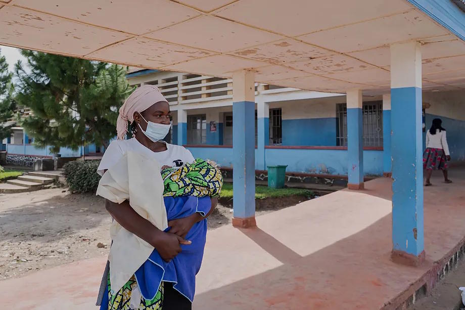 A woman wearing a protective mask in the hallway of a hospital in Bunia, Congo.