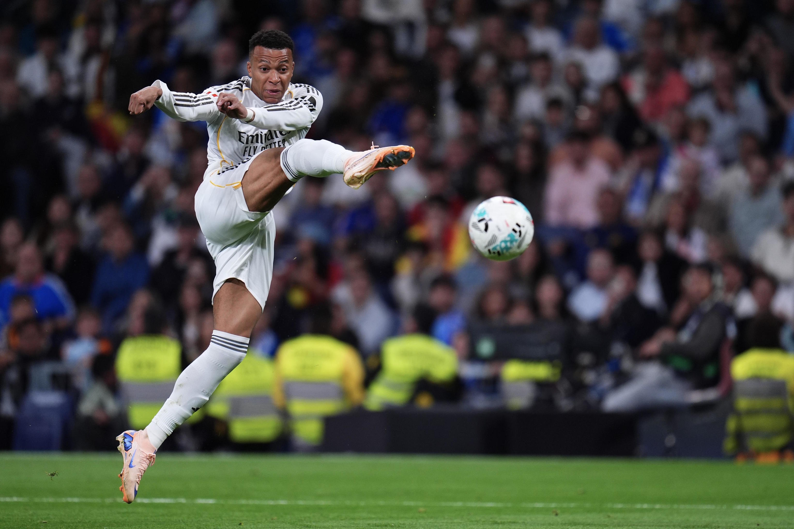Real Madrid's Kylian Mbappe kicks the ball.