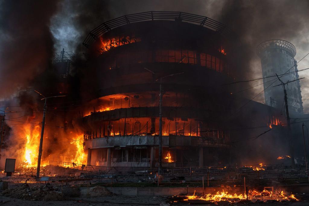 A trade center burns after a Russian strike on Kyiv