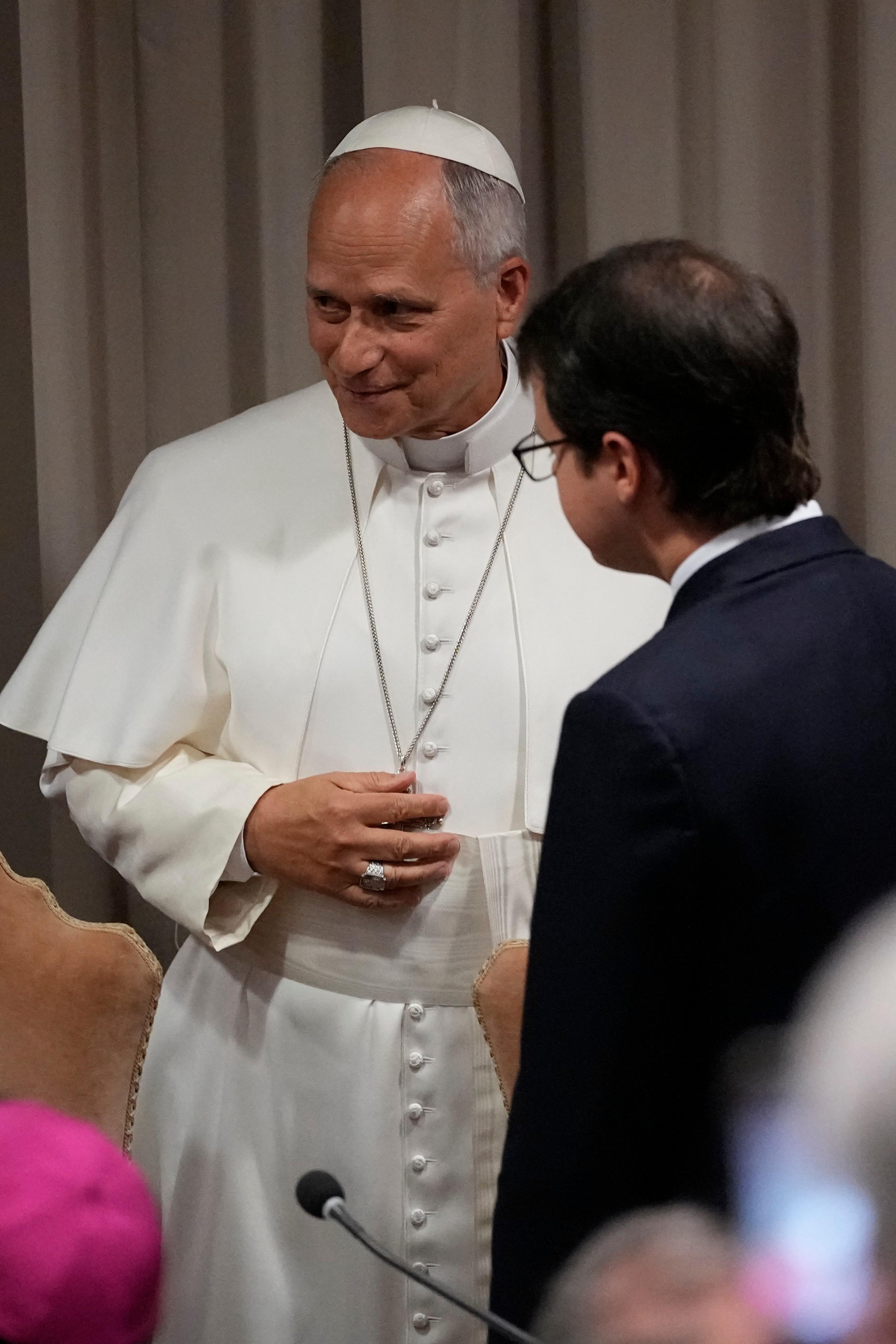 Pope Leon XIV greets Christopher Olah during the event last Monday.