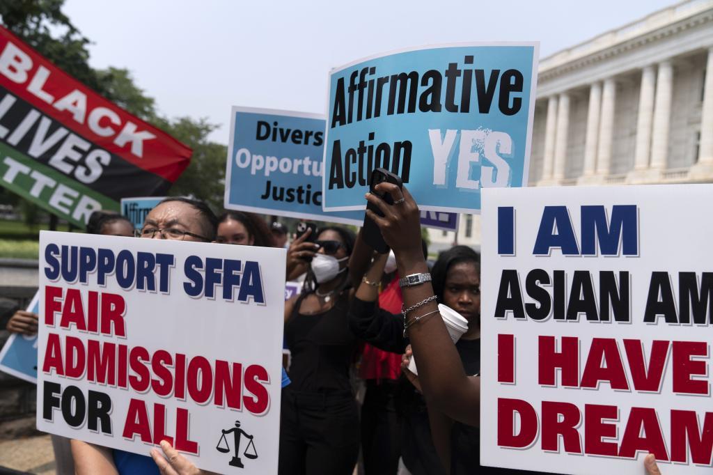 Demonstrators protest outside of the Supreme Court in Washington