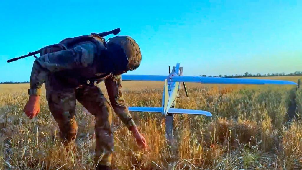 A Russian serviceman launches a drone for an action in an undisclosed location in Ukraine
