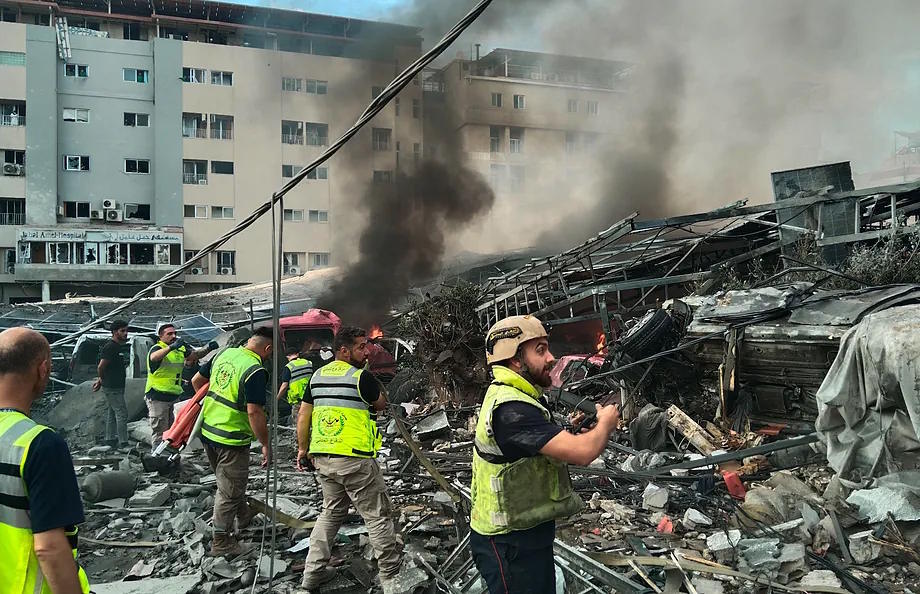 Emergency services search for injured in a building destroyed in Lebanon.