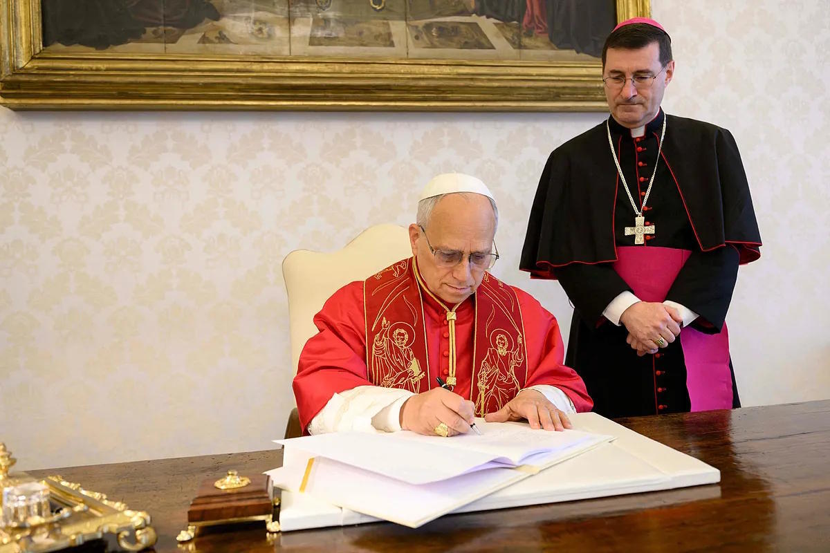 Leo XIV, during the signing of the first encyclical of his pontificate.