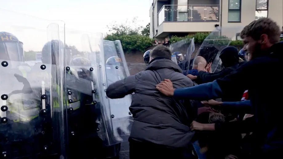 Police and protesters clash during a protest following the death of Henry Nowak.