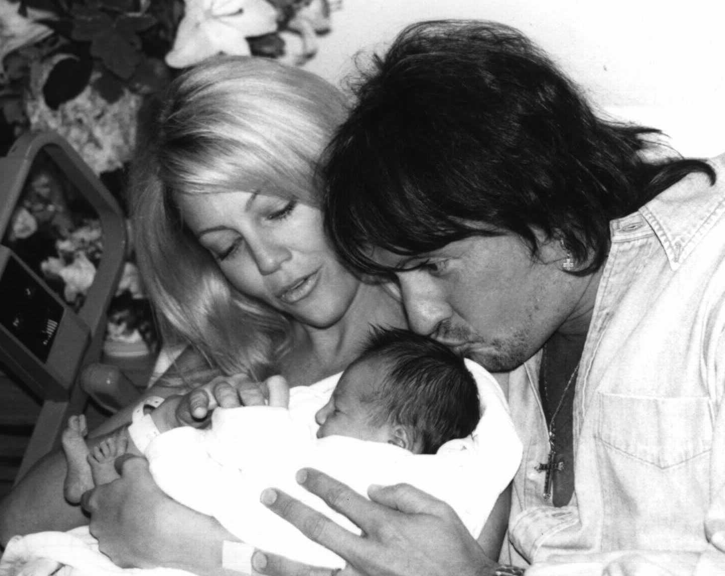 The actress, along with her husband and newborn daughter in 1997.