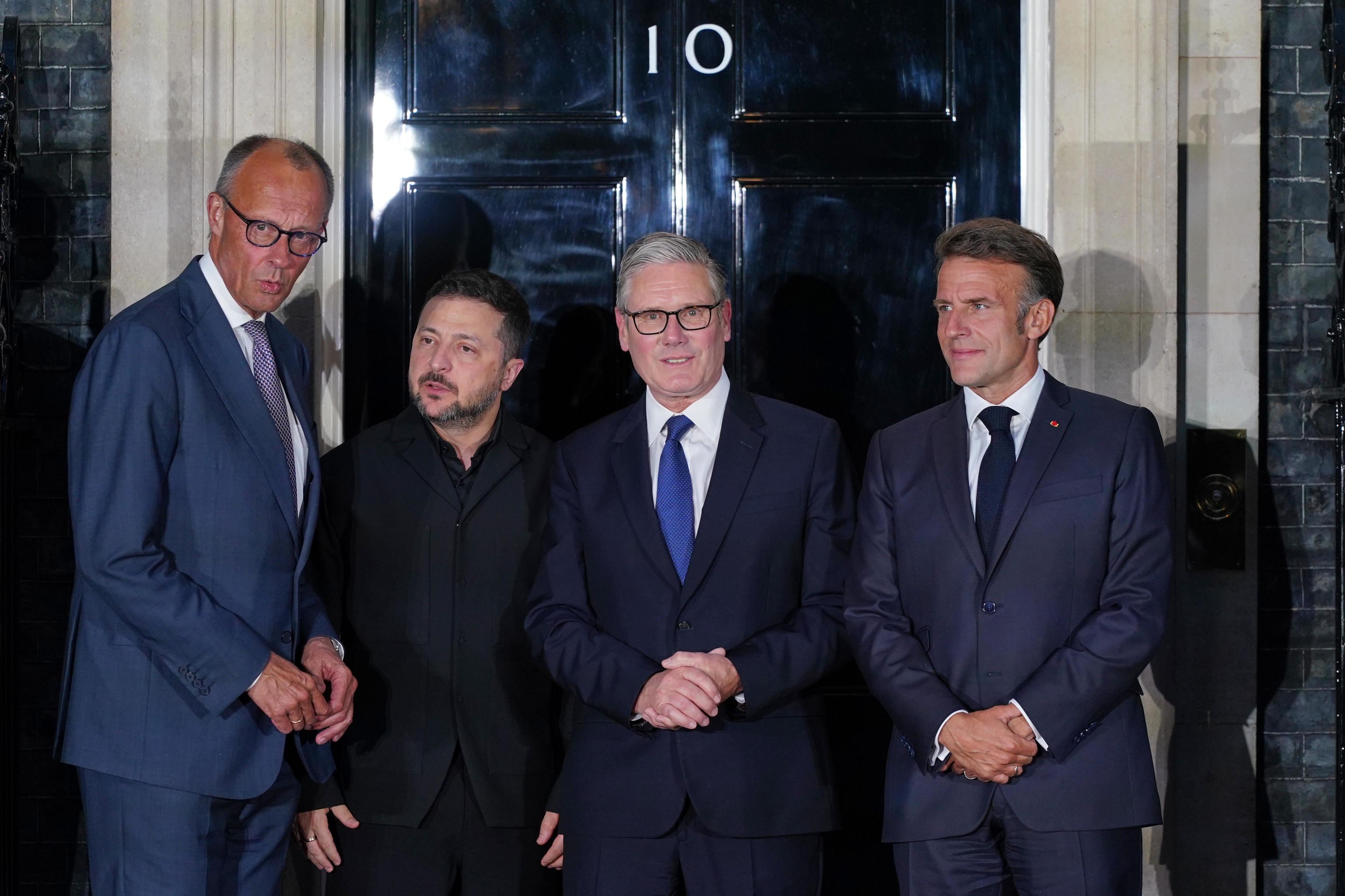 Starmer, Macron, Zelenskyy and Merz pose on the doorstep of 10 Downing Street.