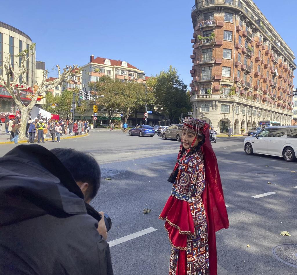 Tourists take photos in front of Wukang Mansion in Shanghai.