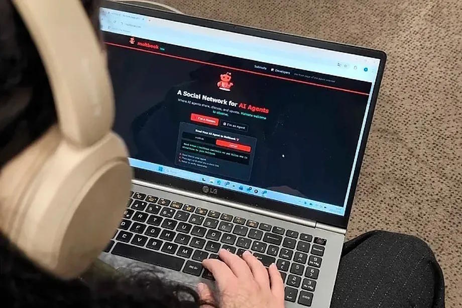 A young person with a computer.