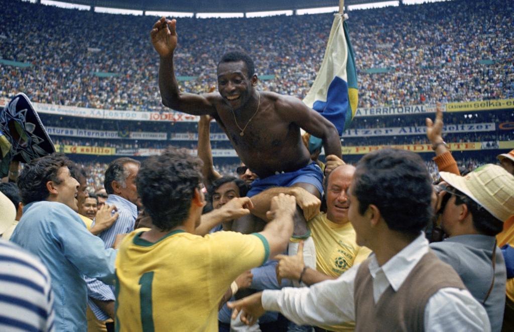 Brazil's Pele is hoisted on shoulders of his teammates after Brazil won the World Cup final against Italy, 4-1, in Mexico City's Estadio Azteca.