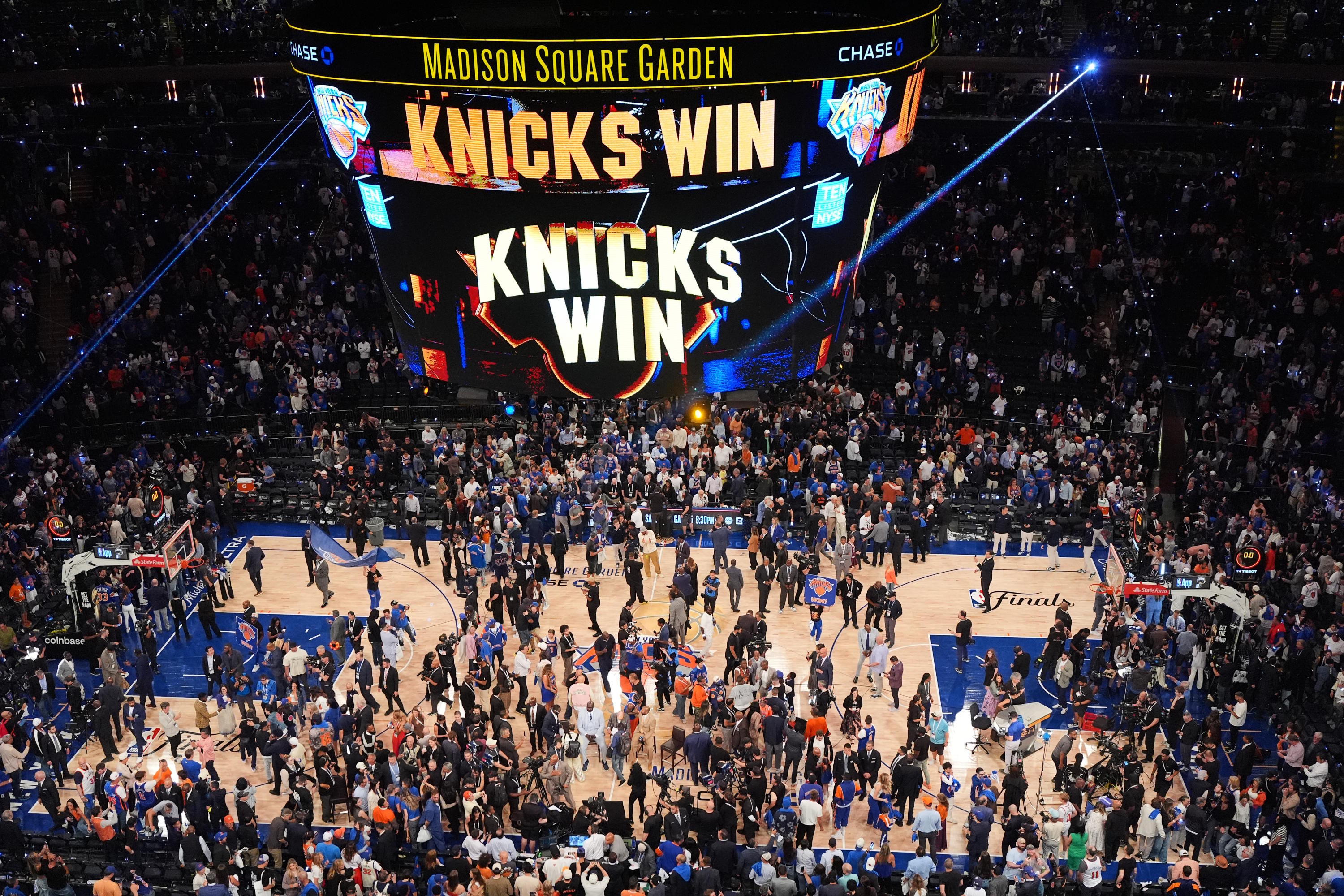 Players and fans celebrate after the New York Knicks' victory.